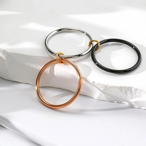 Polished triple-interlocking minimalist rings in silver, rose gold, and black steel