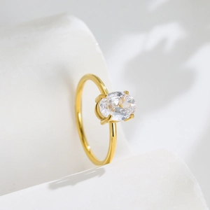Elegant gold titanium ring featuring a horizontal oval-cut zircon in a minimalist setting
