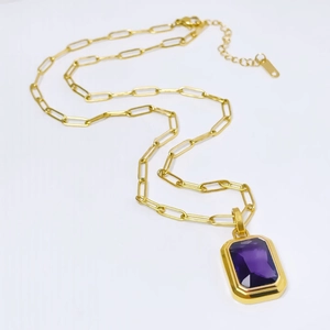 Minimalist gold paperclip chain necklace with a purple emerald-cut zircon pendant