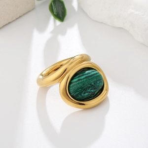 Vintage gold-plated ring featuring large oval green malachite stone with wavy band