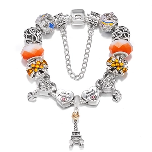 DIY Pandora-style charm bracelet with Eiffel Tower and heart charms on a snake chain