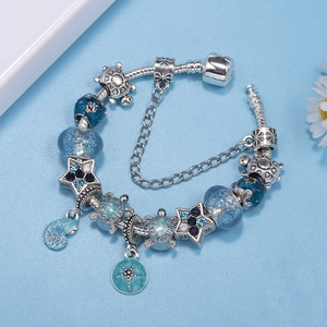 Blue ocean themed charm bracelet with starfish and turtle pendants on silver snake chain