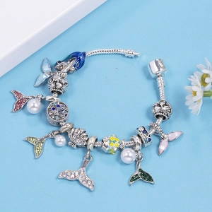 Ocean themed DIY fishtail charm bracelet with silver snake chain and colorful beads