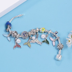 Marine theme silver snake chain bracelet with fish tail, shell, and sea life charms