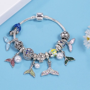 Ocean themed silver snake chain bracelet with fish tail and dolphin charms