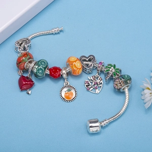 Silver snake chain bracelet with fruit-themed beads, strawberry charms, and Love You clasp
