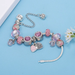 Detail of beaded bracelet with pink crystal beads and best my mother heart charm