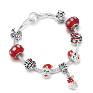 Christmas themed charm bracelet with Santa Claus charms and red enamel beads on silver chain