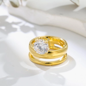 Golden titanium steel ring set with zircon stone shown with elegant leaf shadow shadows