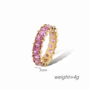 Detail view of 5mm gold plated ring with a full circle of triangular pink crystals