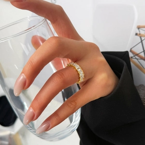 Detailed view of luxury gold titanium ring with sparkling pear-cut cubic zirconia stones