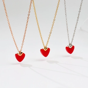 Three minimalist titanium steel heart pendant necklaces in gold, silver and rose gold