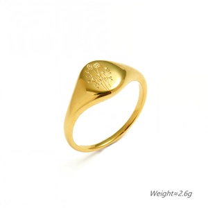 Minimalist gold floral signet ring for women in stainless steel with botanical engraving