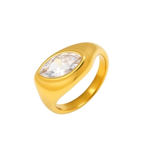 Macro view of gold-plated signet ring with marquise-cut zircon in bezel setting