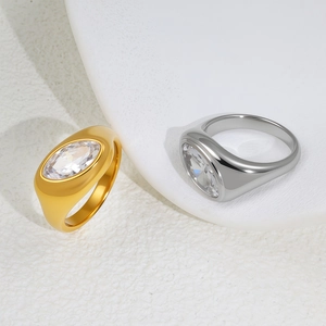 Modern wide band signet ring with oval cubic zirconia in gold and silver finish