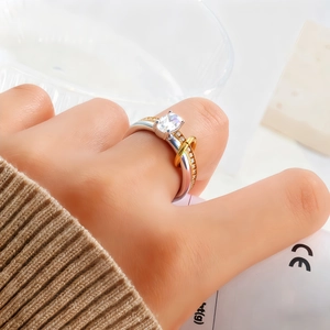 Detailed macro of two-tone stainless steel ring with square diamond and CE tag