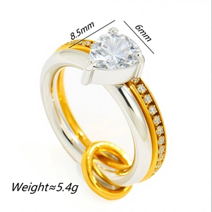 Close-up of two-tone stainless steel double ring with 8.5x6mm pear-cut moissanite stone