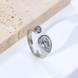 Adjustable silver titanium ring with pear and round drop-shaped sparkling crystals