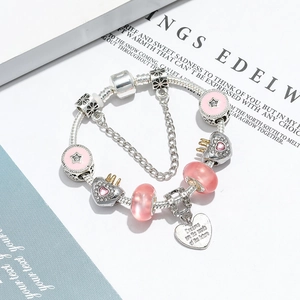 Pink crystal heart crown charm bracelet on silver snake chain with inspiring quote