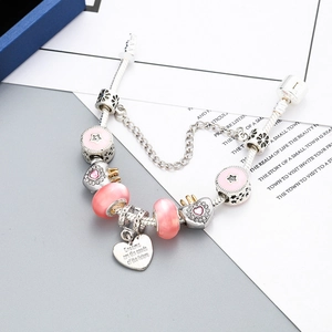 Pink crystal heart and crown charm bracelet on silver snake chain with dream pendant