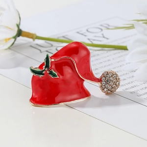 Sparkling red Christmas hat brooch with rhinestones and green holly leaf on gift card
