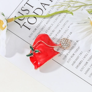 Sparkling Christmas hat brooch with red enamel and rhinestones on festive background