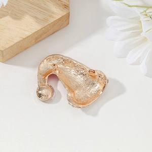 Golden Christmas hat brooch with frosted finish back and secure safety pin fastener