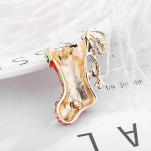 Christmas stocking brooch in gold-plated alloy with star pendant and enamel details