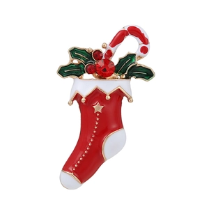 Christmas stocking brooch with candy cane and holly leaves in red enamel and gold finish