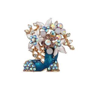 Fashionable golden Christmas boot brooch with blue enamel and sparkling rhinestones
