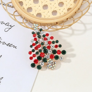 Sparkling Christmas tree brooch with colorful rhinestones on a gold metal base