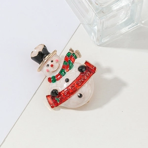 Festive enamel snowman brooch with Let It Snow sign and colorful striped scarf