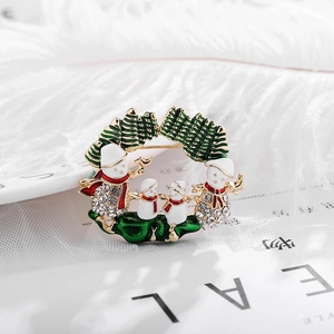 Christmas snowman wreath brooch with white crystals and green enamel on golden alloy base