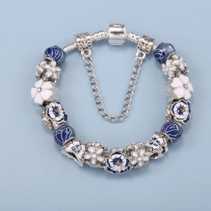 Blue and white floral beaded snake chain bracelet with heart clasp and safety chain