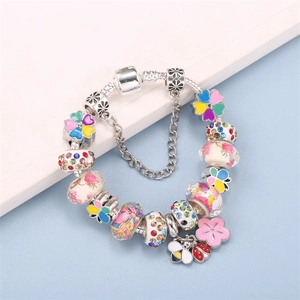 Colorful floral charm bracelet with bee, ladybug, and enamel flower beads on silver chain