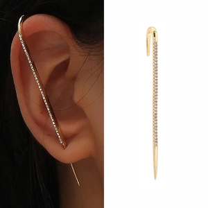 Detail of gold lightning bolt ear cuff with inset pearls and cubic zirconia stones