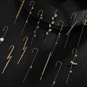 Detail of luxury lightning and leaf ear hooks with pearls and cubic zirconia stones