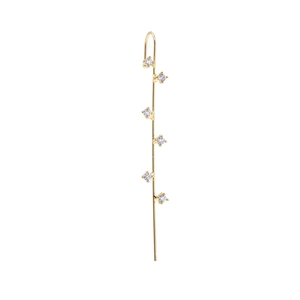 Macro detail of gold ear crawler earring featuring six sparkling claw-set cubic zirconia stones