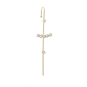 Macro detail of gold lightning cartilage earring with pearls and zircon stones