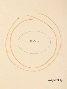 Detail of double-layer gold star body chain with dimensions 82+5cm and 21.5g weight