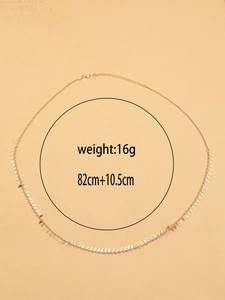 Detail view of a gold double-layer star waist chain with measurements and lobster clasp