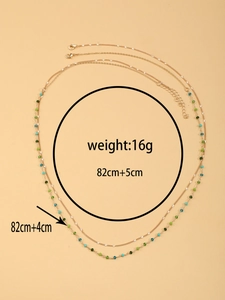 Detail of gold crystal waist chain with green beads measuring 82cm and weighing 16g