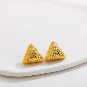 Detailed macro view of 18K gold stainless steel triangle earrings with geometric texture