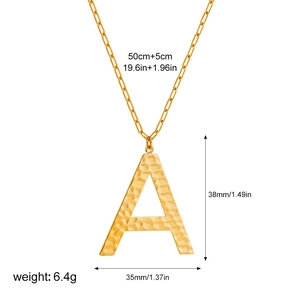 Detail view of gold letter A pendant with hammered texture and dimensions on rectangular chain