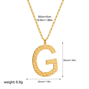Gold letter G necklace detail showing 38x30mm pendant size and 50cm paperclip chain