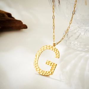 Golden hammer-textured capital letter G pendant necklace with classic link chain