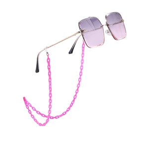 Detail of purple gradient oversized sunglasses with chunky pink acrylic chain links