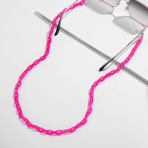 Detail of bright pink translucent acrylic Y2K chain links with polished finish