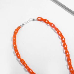 Detail of orange acrylic sunglasses chain with white non-slip silicone rubber loops