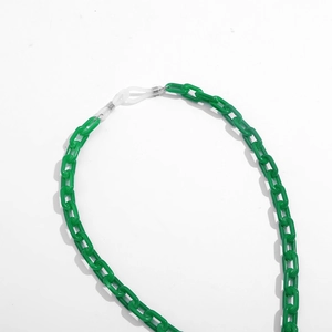 Macro shot of dark green acrylic link glasses chain with white silicone anti-slip ends